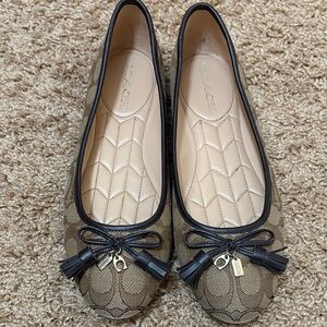 Coach flats with tassels